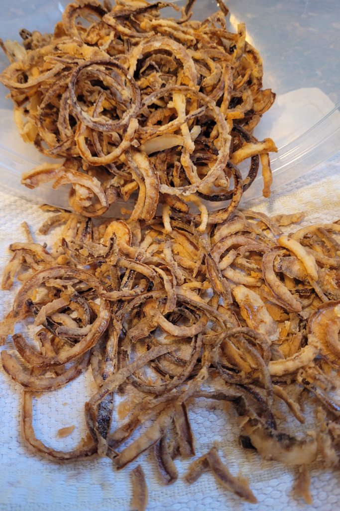 Image illustrates sliced onions for homemade fried onions.