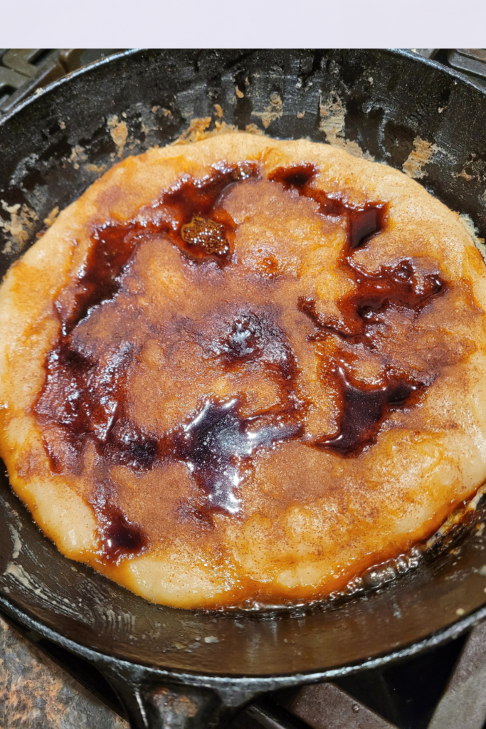 Image illustrates cinnamon roll pizza.